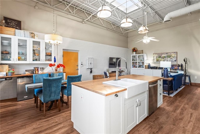 5097 Peachtree Rd Unit I, Atlanta, GA 30341 - kitchen featuring butcher block counters, a high ceiling, dishwasher, dark wood-style flooring, and a ceiling fan