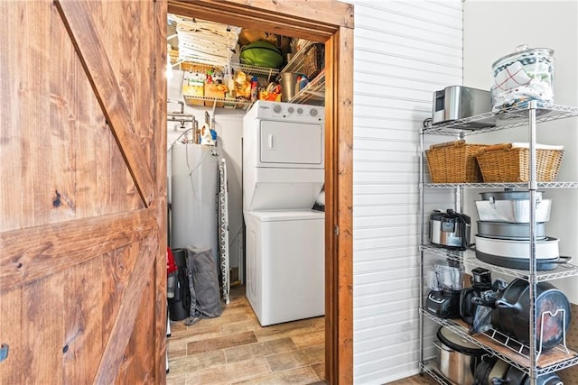 5097 Peachtree Rd Unit I, Atlanta, GA 30341 - washroom featuring stacked washer / dryer, water heater, and wood finished floors