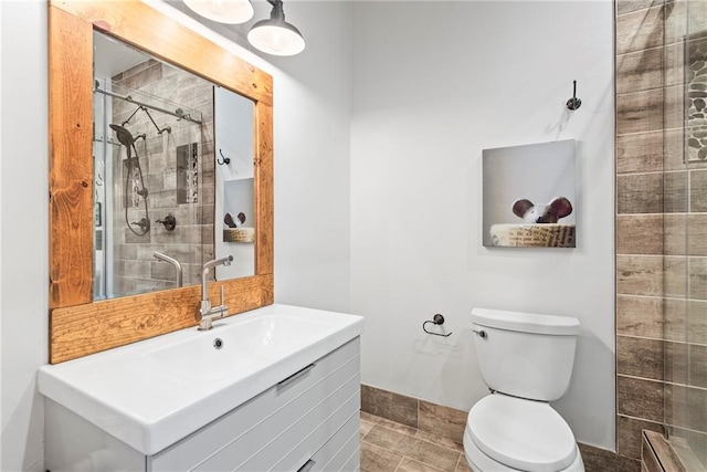 5097 Peachtree Rd Unit I, Atlanta, GA 30341 - bathroom featuring vanity, toilet, and a stall shower