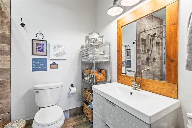 5097 Peachtree Rd Unit I, Atlanta, GA 30341 - full bathroom featuring toilet, vanity, a tile shower, and baseboards