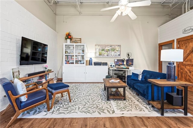 5097 Peachtree Rd Unit I, Atlanta, GA 30341 - living area featuring ceiling fan, wood finished floors, and a towering ceiling