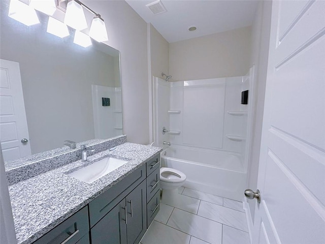 full bathroom featuring toilet, tile patterned flooring, vanity, and bathtub / shower combination