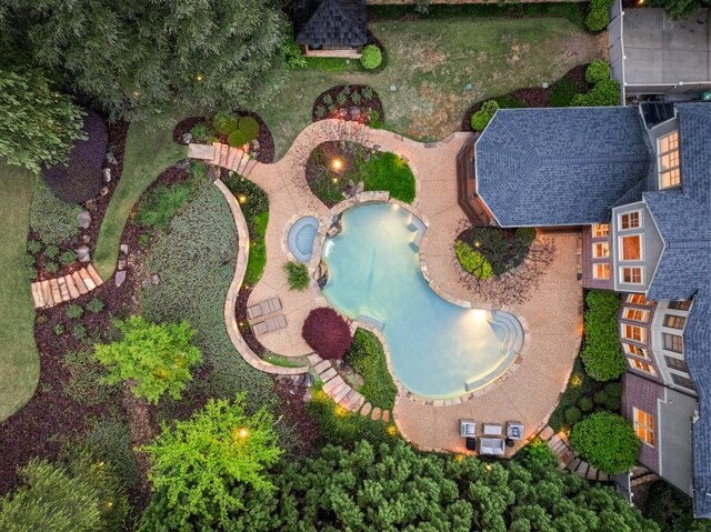 back of house with a pool with hot tub, a patio, and a gazebo