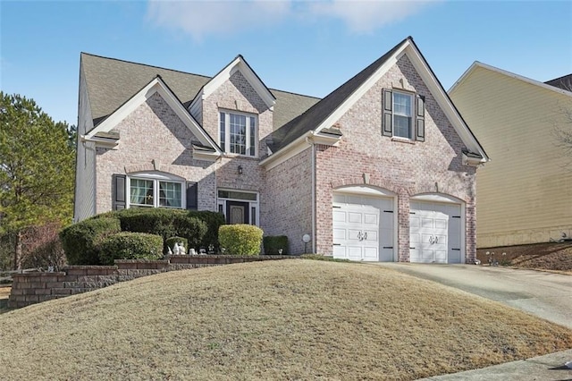 view of front facade with a front lawn and a garage