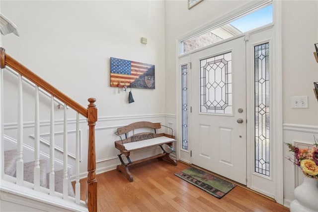 foyer entrance with hardwood / wood-style flooring and a wealth of natural light