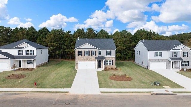 view of front of home with a front yard and a garage