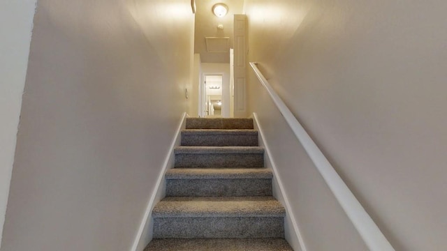 1169 Oaks Pl, Stone Mountain, GA 30083 - staircase with baseboards and carpet