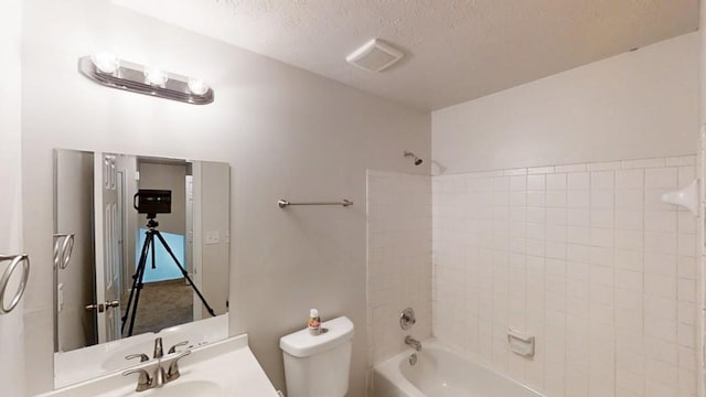 1169 Oaks Pl, Stone Mountain, GA 30083 - full bath with shower / bathtub combination, a textured ceiling, and vanity