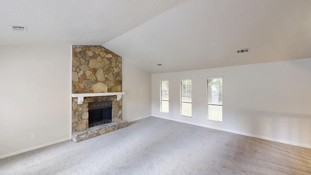 1169 Oaks Pl, Stone Mountain, GA 30083 - unfurnished living room with lofted ceiling, carpet, and a stone fireplace