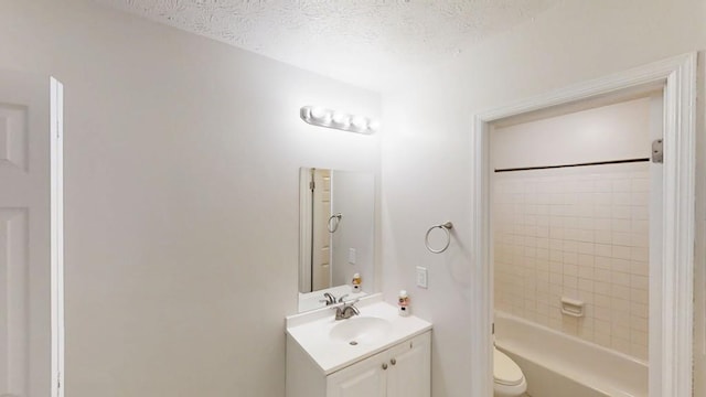 1169 Oaks Pl, Stone Mountain, GA 30083 - full bath featuring vanity, a textured ceiling, and shower / washtub combination