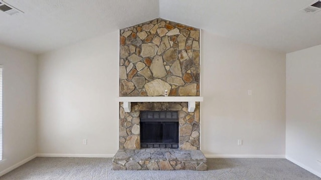 1169 Oaks Pl, Stone Mountain, GA 30083 - unfurnished living room with carpet flooring, lofted ceiling, and a fireplace