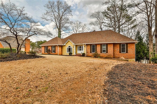 ranch-style house with brick siding