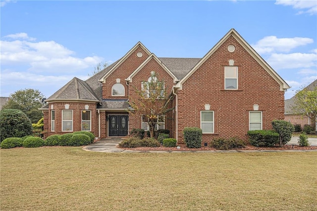 view of front of house featuring french doors and a front yard