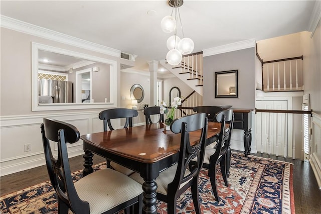 1634 Ponce De Leon Ave Unit 107, Atlanta, GA 30307 - dining space featuring wood finished floors, ornamental molding, stairway, and decorative columns