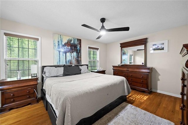 69 Due W Pass, Dallas, GA 30157 - bedroom with ceiling fan, baseboards, a textured ceiling, and light wood-type flooring