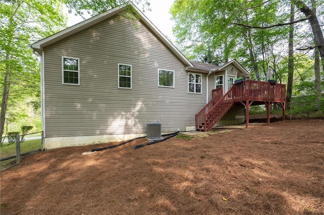 69 Due W Pass, Dallas, GA 30157 - back of house featuring central air condition unit, fence, a deck, and stairs