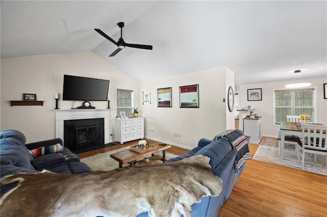 69 Due W Pass, Dallas, GA 30157 - living area with a fireplace with flush hearth, wood finished floors, baseboards, and ceiling fan