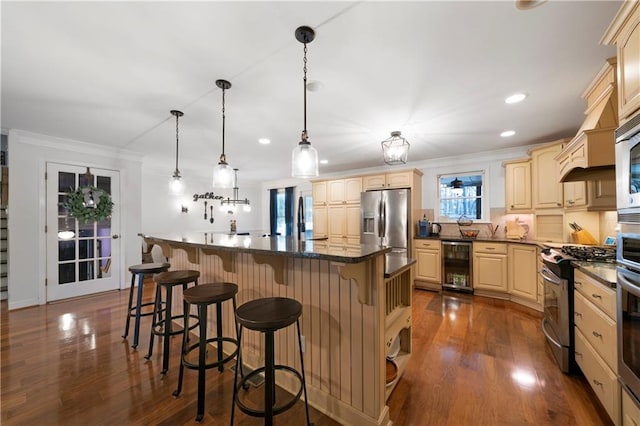 kitchen featuring dark countertops, wine cooler, appliances with stainless steel finishes, dark wood-style flooring, and crown molding