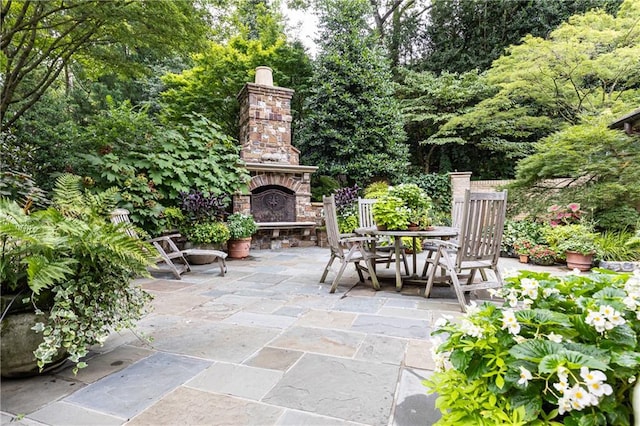 view of patio with an outdoor stone fireplace