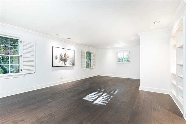 unfurnished room featuring ornamental molding and dark wood-type flooring