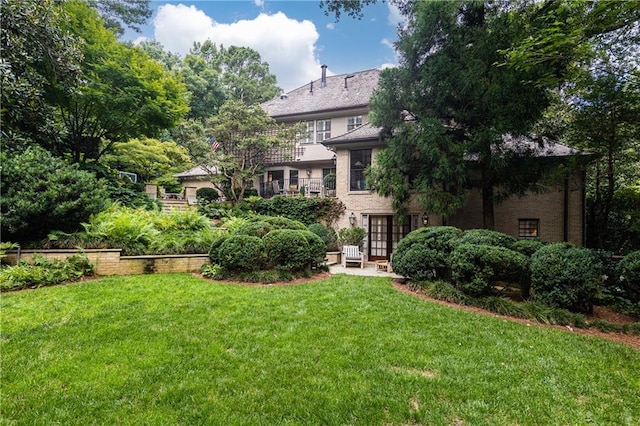 view of yard featuring french doors