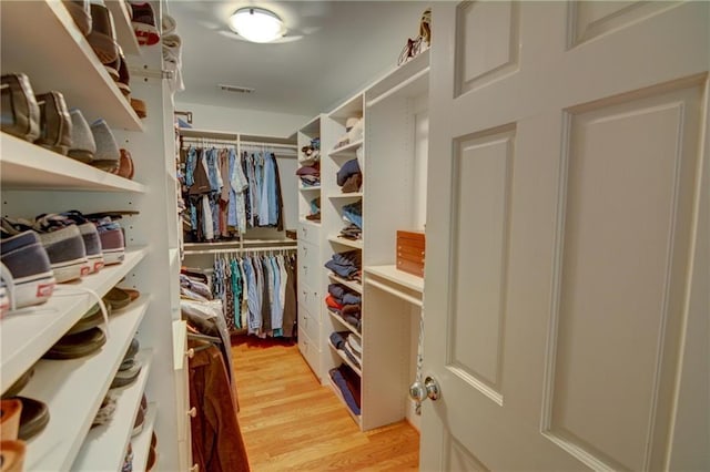 spacious closet with visible vents and light wood-type flooring
