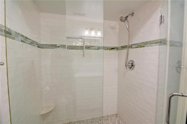 bathroom with a shower stall
