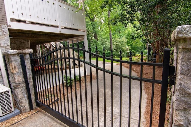 view of gate featuring stairway