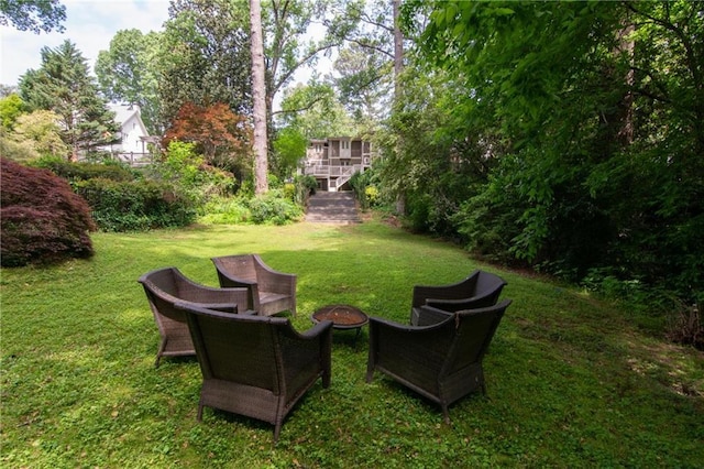 view of yard with an outdoor fire pit