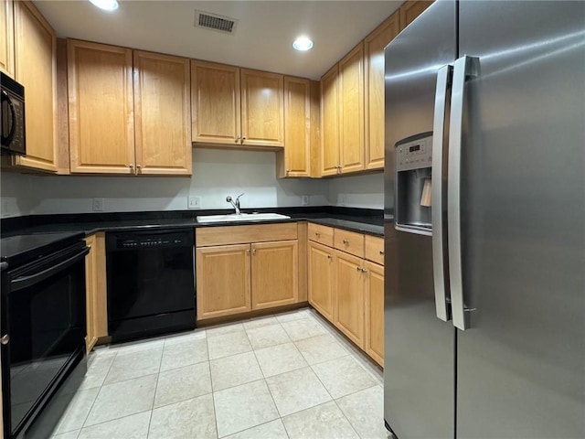 195 14th St NE Unit 303, Atlanta, GA 30309 - kitchen with black appliances, recessed lighting, dark countertops, and light tile patterned floors
