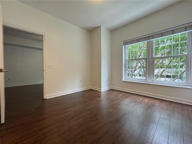 195 14th St NE Unit 303, Atlanta, GA 30309 - spare room with dark wood-type flooring and baseboards