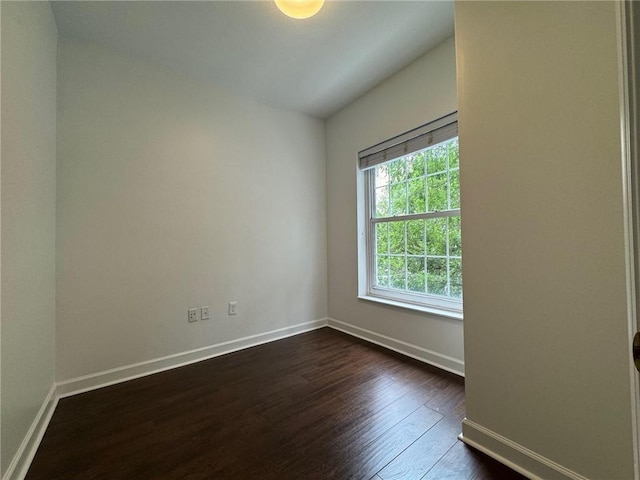 195 14th St NE Unit 303, Atlanta, GA 30309 - empty room with dark wood-style floors and baseboards