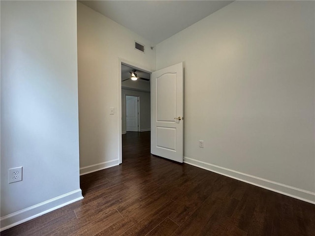 195 14th St NE Unit 303, Atlanta, GA 30309 - spare room featuring dark wood-type flooring and baseboards