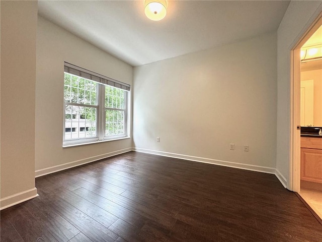 195 14th St NE Unit 303, Atlanta, GA 30309 - unfurnished room with dark wood-style flooring and baseboards
