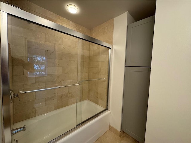 195 14th St NE Unit 303, Atlanta, GA 30309 - bathroom featuring enclosed tub / shower combo and tile patterned floors
