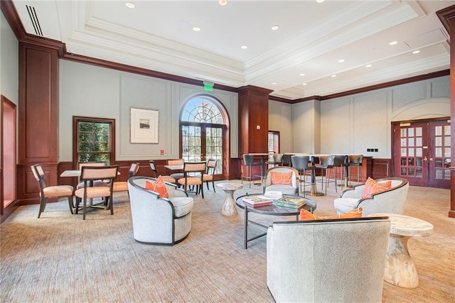 195 14th St NE Unit 303, Atlanta, GA 30309 - living area with a decorative wall, french doors, crown molding, light carpet, and a tray ceiling