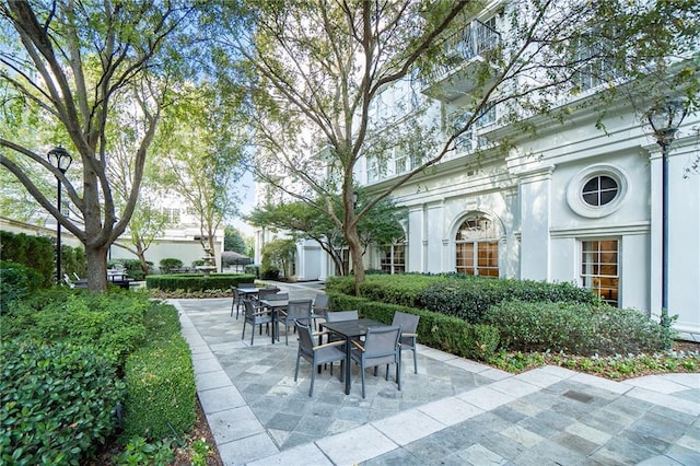 195 14th St NE Unit 303, Atlanta, GA 30309 - view of patio / terrace featuring outdoor dining space and a storage unit