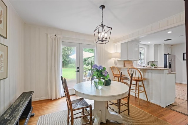 3357 Pretty Branch Dr SE, Smyrna, GA 30080 - dining space featuring french doors, healthy amount of natural light, light wood-type flooring, and a chandelier