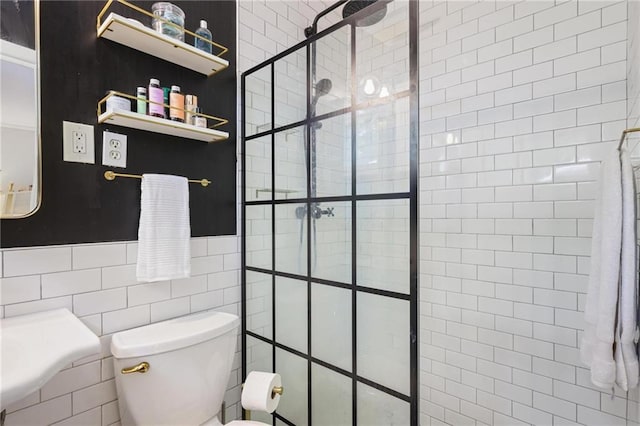 3357 Pretty Branch Dr SE, Smyrna, GA 30080 - bathroom featuring toilet, a tile shower, tile walls, and a wainscoted wall