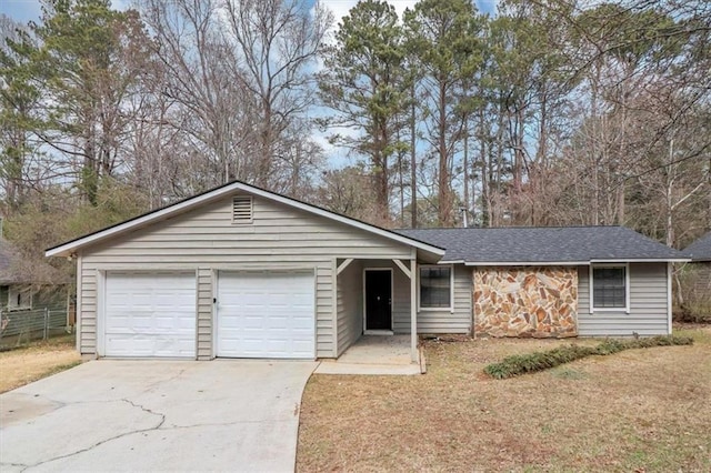 ranch-style house featuring a garage and a front lawn