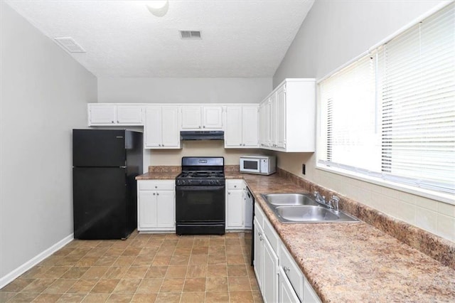 kitchen with white cabinetry, sink, a textured ceiling, and black appliances