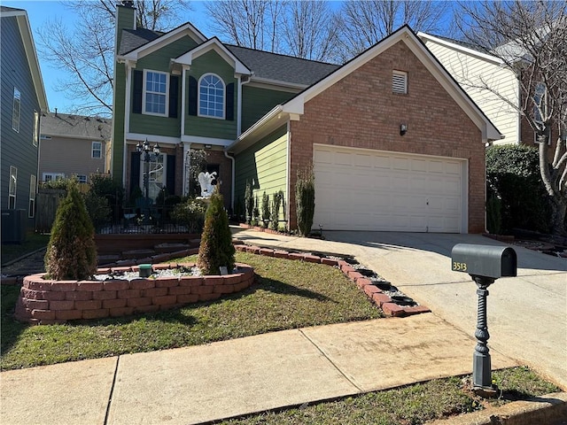 traditional-style home featuring brick siding, a chimney, concrete driveway, and a garage