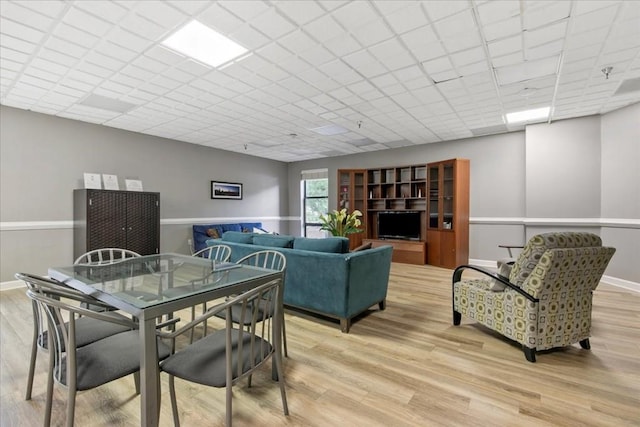 dining area with light hardwood / wood-style flooring