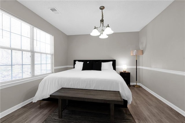 2917 Duncan Pl, Decatur, GA 30034 - bedroom with wood finished floors and a chandelier