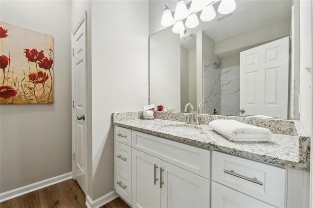 bathroom with vanity and hardwood / wood-style flooring