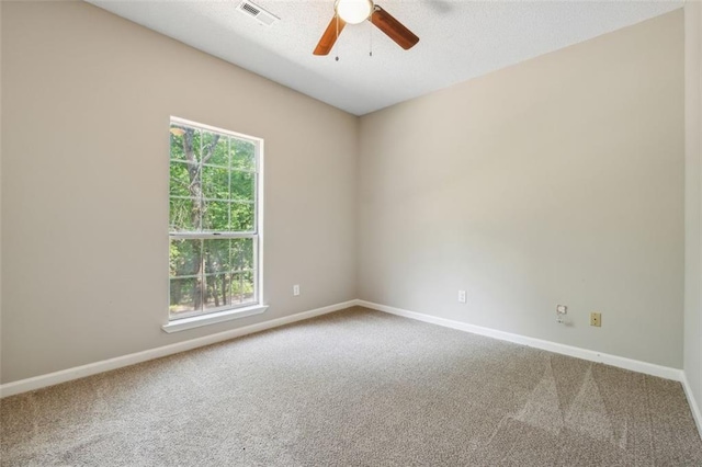 spare room with carpet flooring and ceiling fan