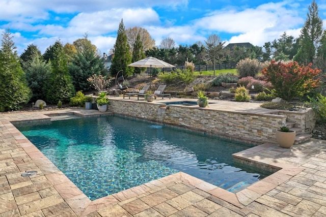 view of pool featuring a patio