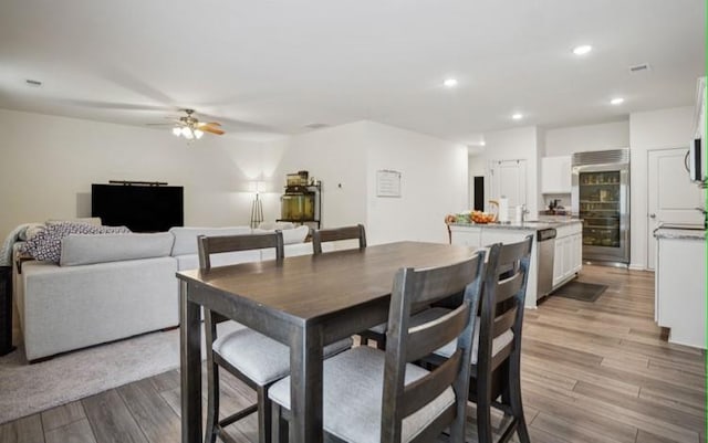 dining area featuring ceiling fan and light hardwood / wood-style flooring