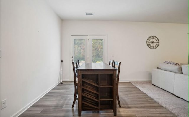 dining space featuring dark hardwood / wood-style flooring