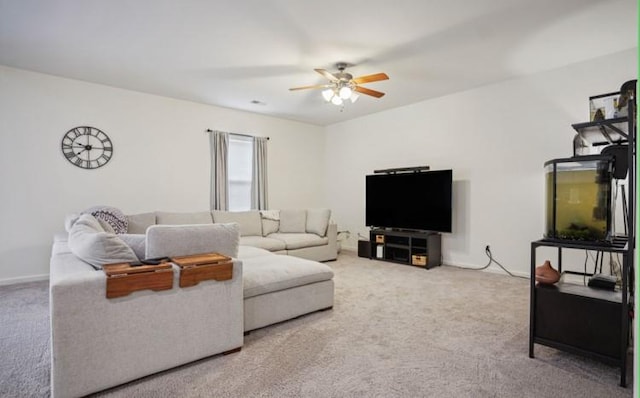 living room with ceiling fan and carpet